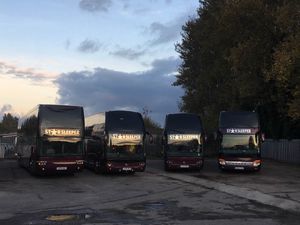 Double decker tour buses